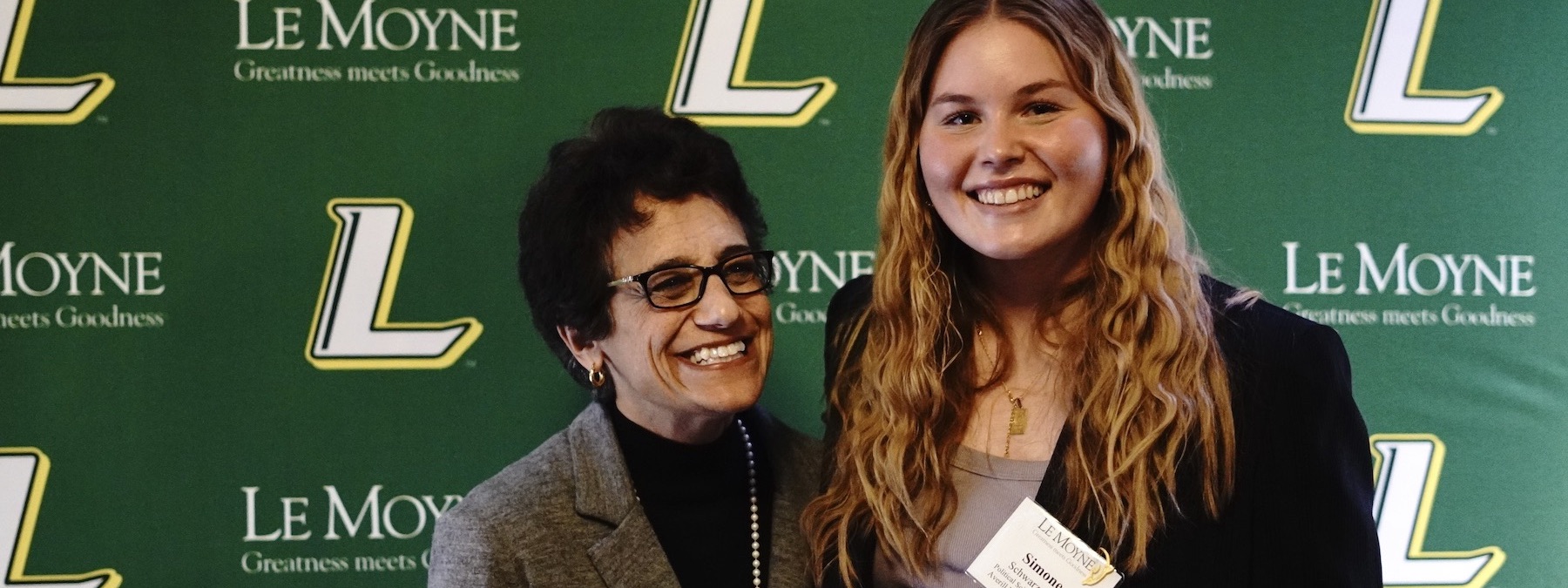 President Linda LeMura with an accepted student at a presidential reception.