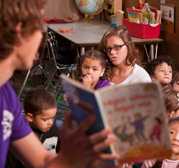 Male student teaching during story time.