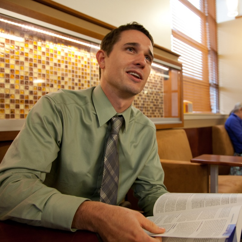 Male student giving a speech.